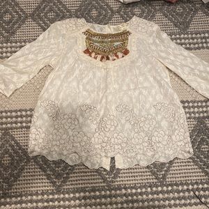 Cream colored blouse.  3/4 sleeves.  Embroidered.  Worn once
